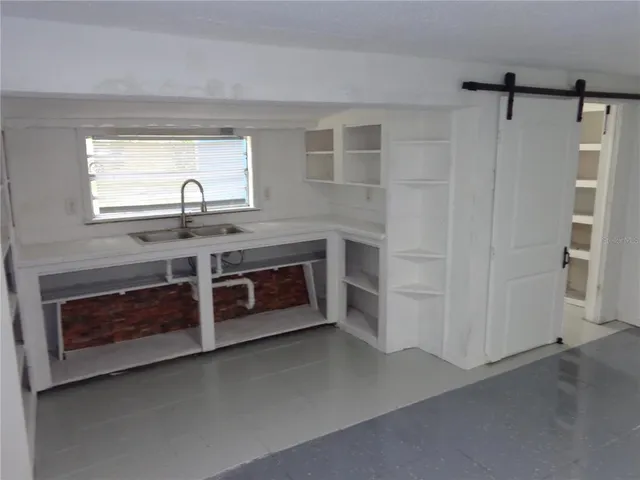 a kitchen with stainless steel appliances a stove and a refrigerator