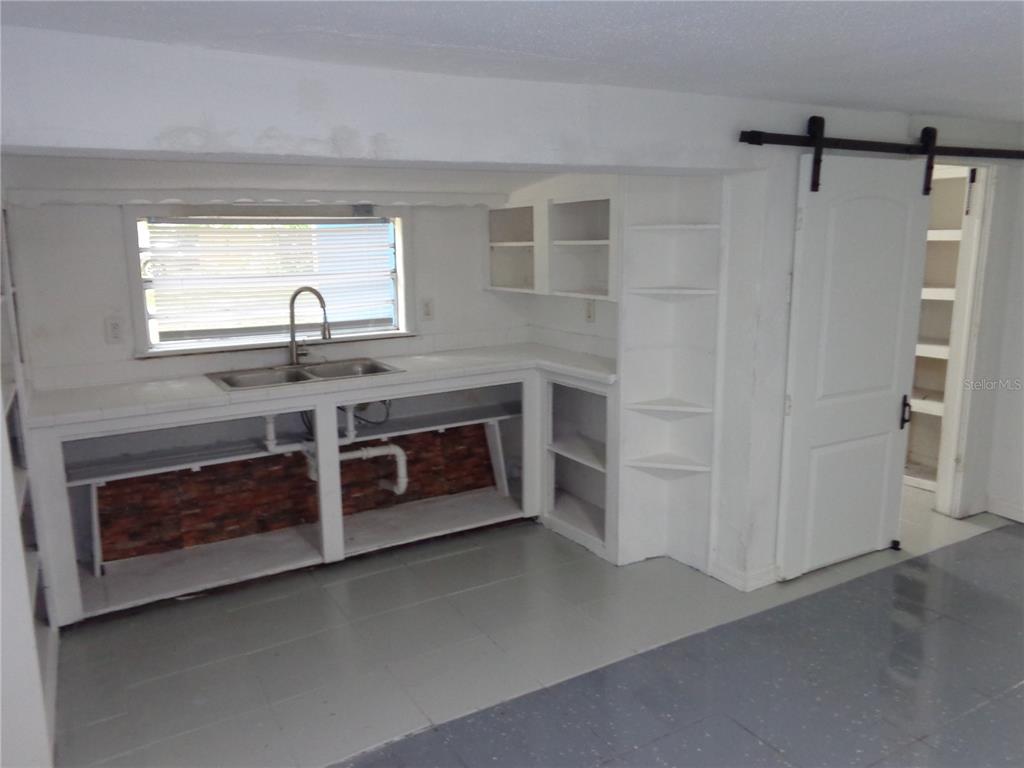 2878 Northeast 161st Street Citra, FL 32113 - Photo 16 of 38 a kitchen with stainless steel appliances a stove and a refrigerator