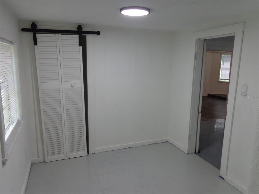 2878 Northeast 161st Street Citra, FL 32113 - Photo 19 of 38 an empty room with windows