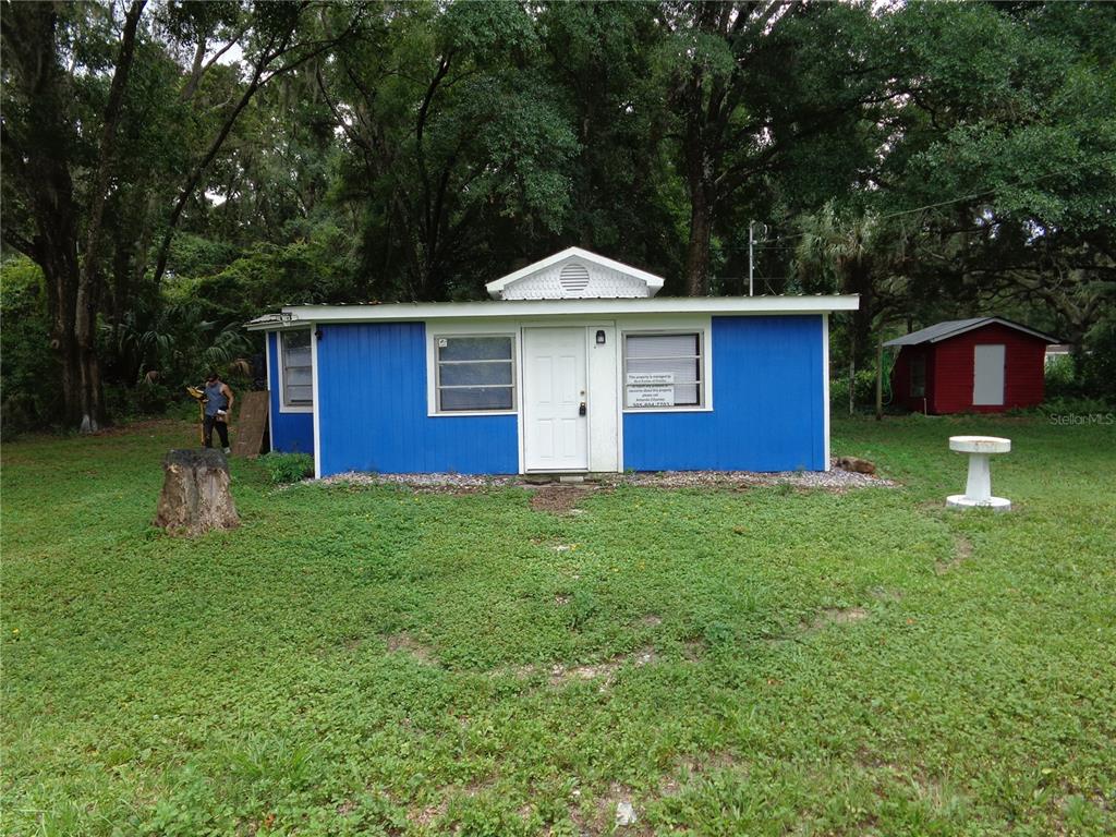2878 Northeast 161st Street Citra, FL 32113 - Photo 2 of 38 a front view of a house with a yard