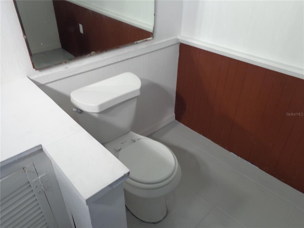 2878 Northeast 161st Street Citra, FL 32113 - Photo 23 of 38 a bathroom with a toilet