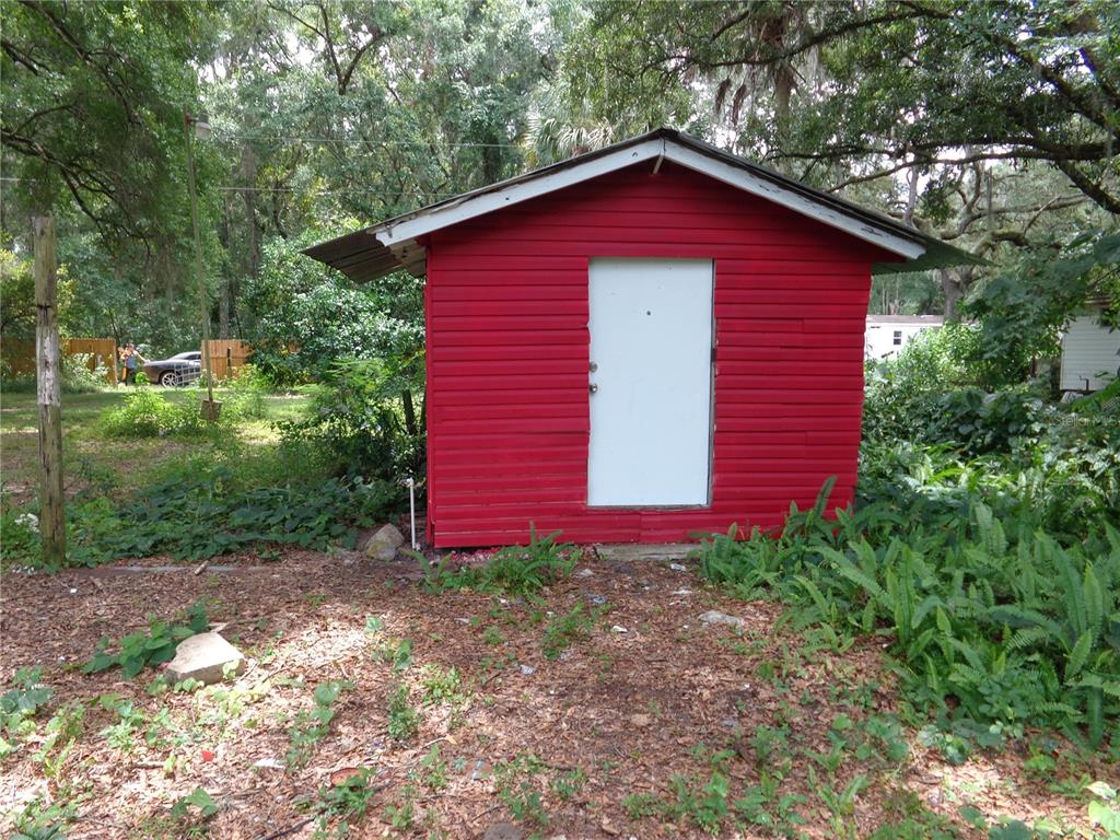 2878 Northeast 161st Street Citra, FL 32113 - Photo 24 of 38 a view of a house with a yard