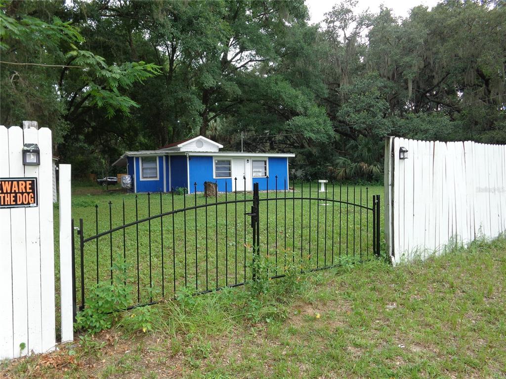 2878 Northeast 161st Street Citra, FL 32113 - Photo 33 of 38 a view of a house with backyard and deck