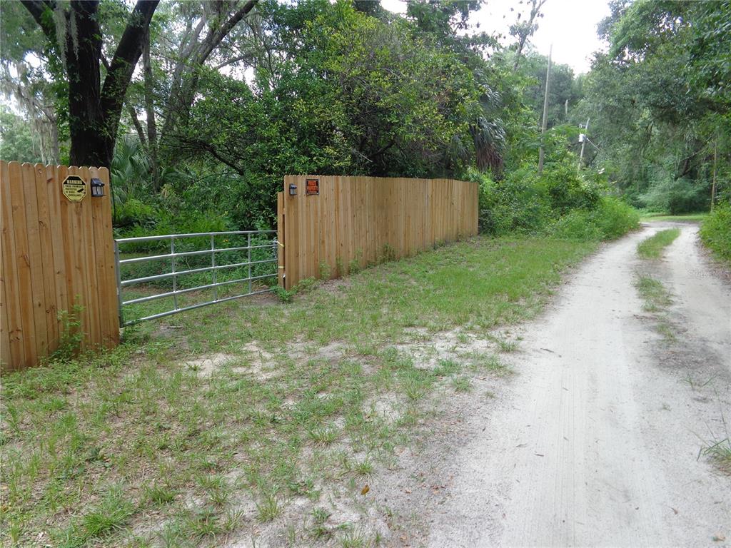 2878 Northeast 161st Street Citra, FL 32113 - Photo 37 of 38 a view of a backyard with green space