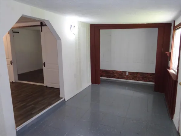 a view of room with window and hardwood floor