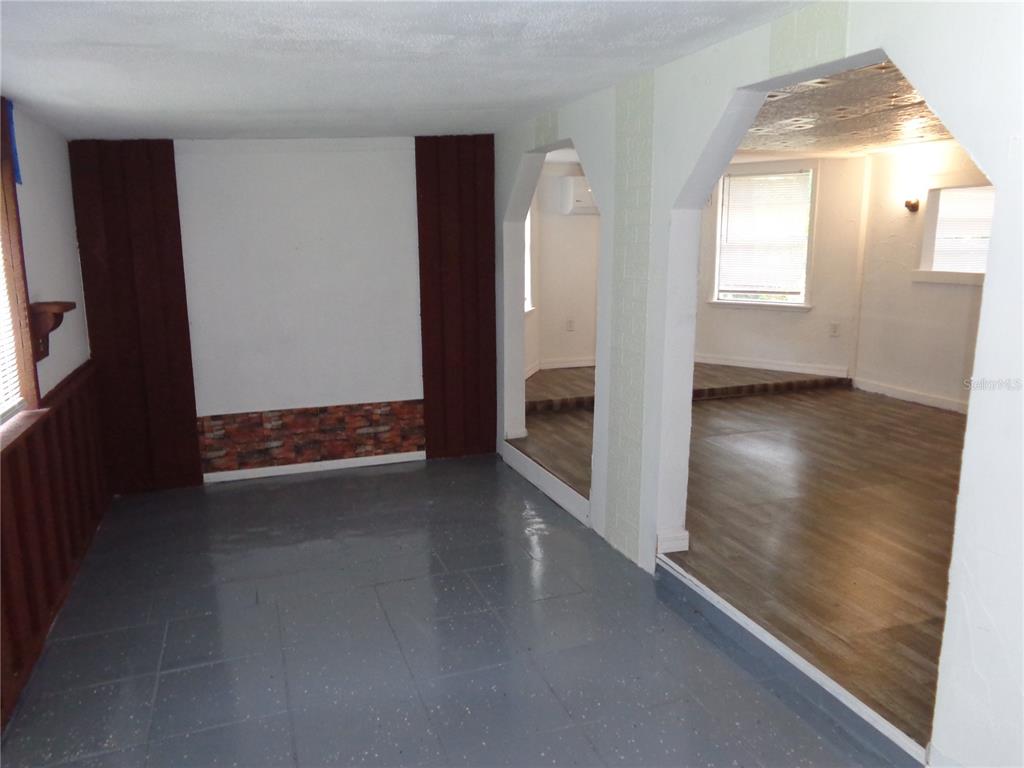 2878 Northeast 161st Street Citra, FL 32113 - Photo 9 of 38 an empty room with wooden floor and windows