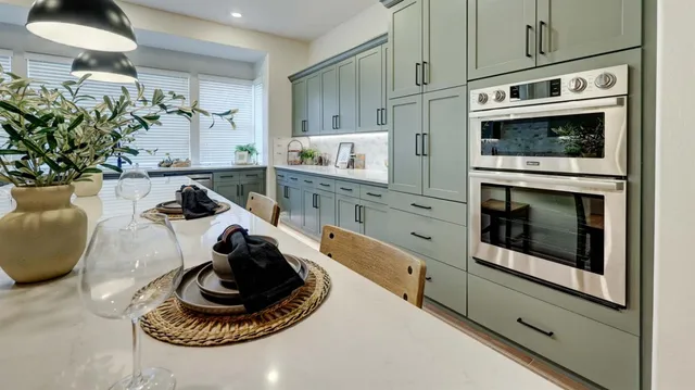 a kitchen with a stove and cabinets