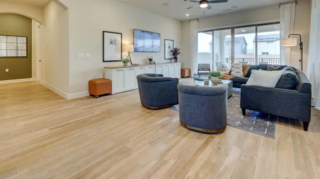 a living room with furniture and a large window