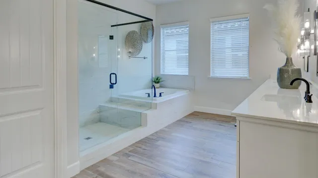 a bathroom with a bathtub and a sink