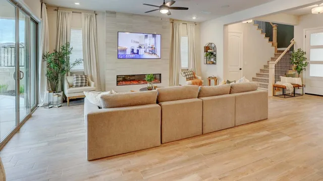 a living room with furniture and a flat screen tv