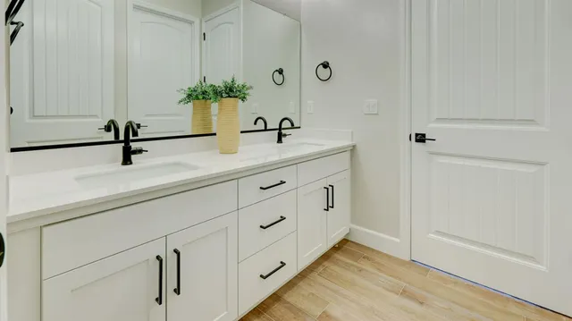 a bathroom with a sink and a mirror