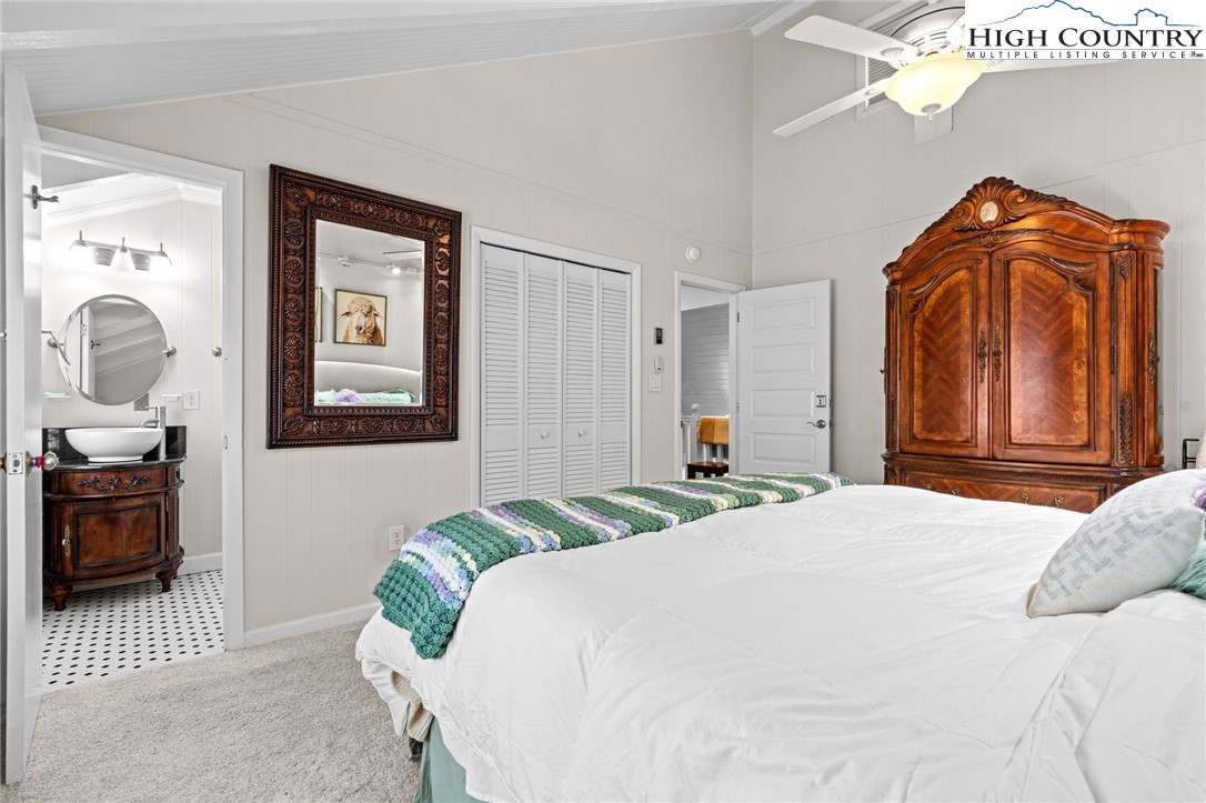 123 St Andrews Road Beech Mountain, NC 28604 - Photo 19 of 50 a bedroom with a bed and wooden floor