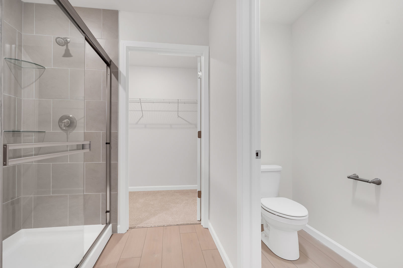 668 Switchgrass Way Bolingbrook, IL 60490 - Photo 13 of 21 a bathroom with a toilet and a shower