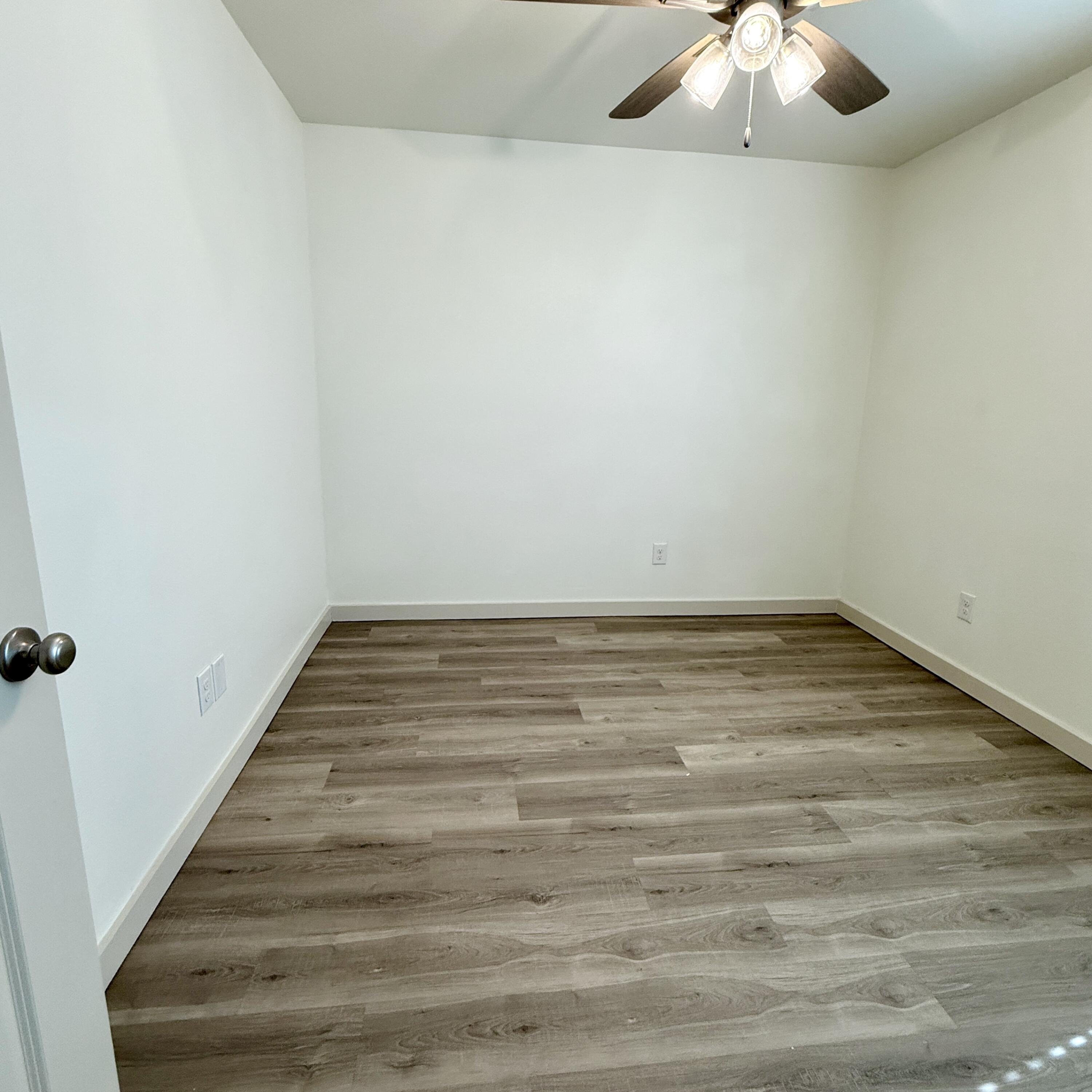 7702 Elm Avenue Lubbock, TX 79404 - Photo 13 of 16 a view of wooden floor