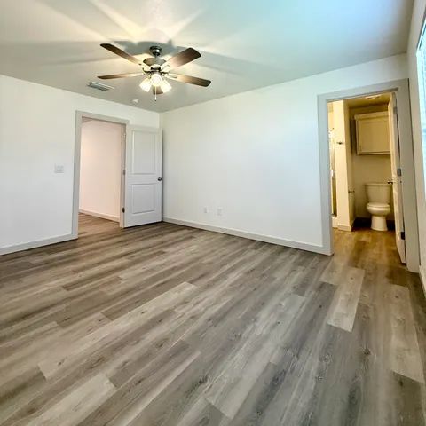 a view of a livingroom with a chandelier fan