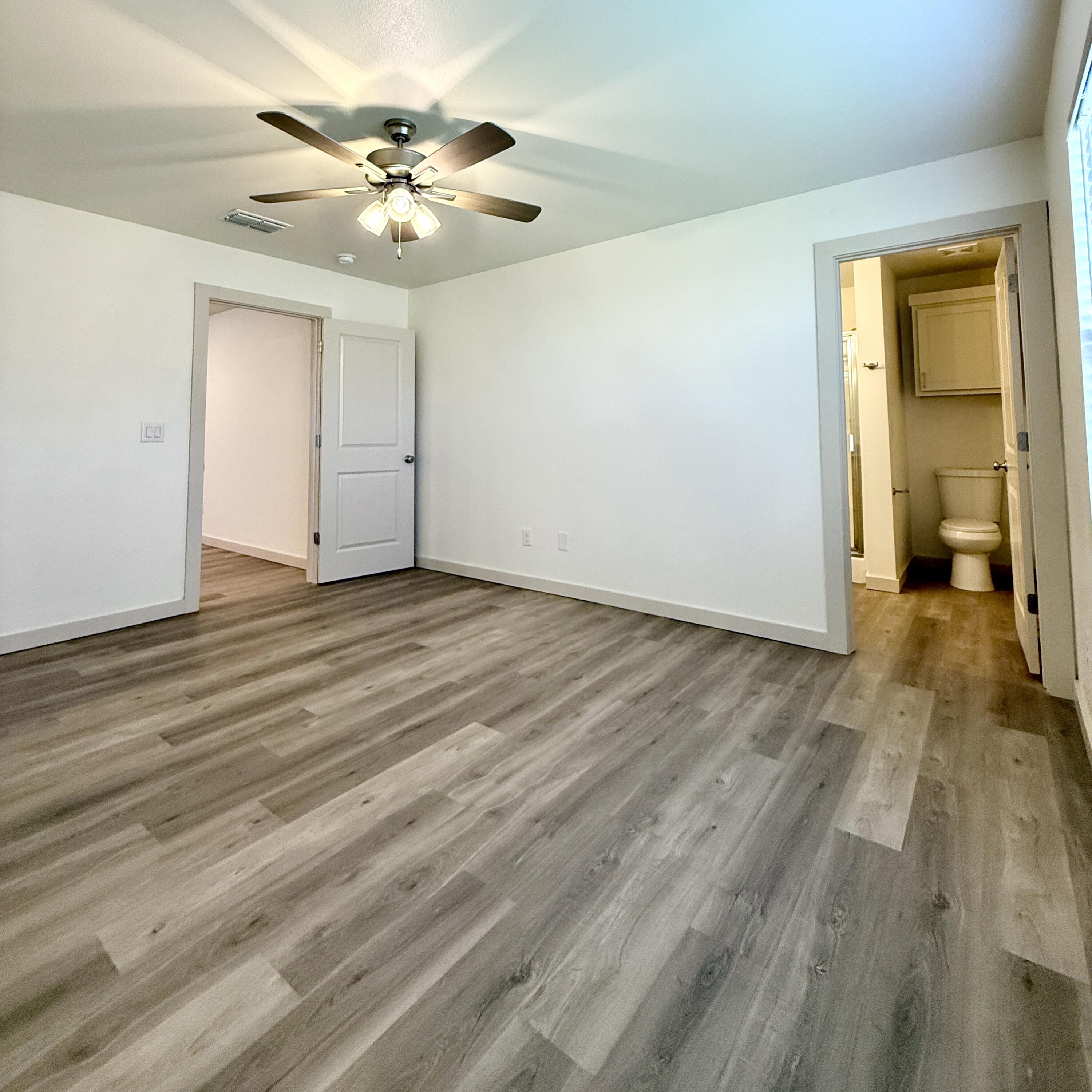 7702 Elm Avenue Lubbock, TX 79404 - Photo 6 of 16 a view of a livingroom with a chandelier fan