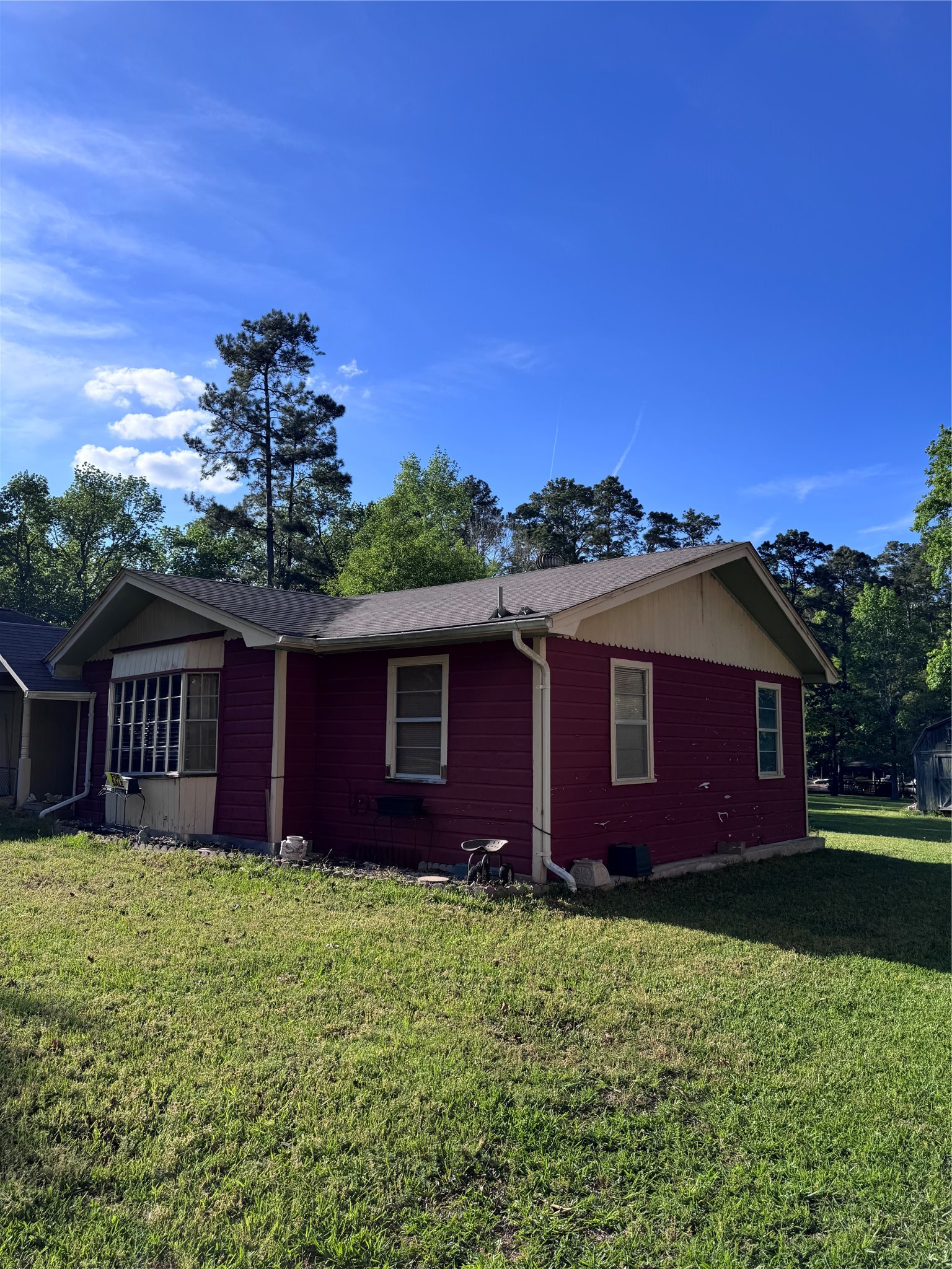 479 County Road Goodrich, TX 77335 - Photo 2 of 16 a front view of a house with a garden