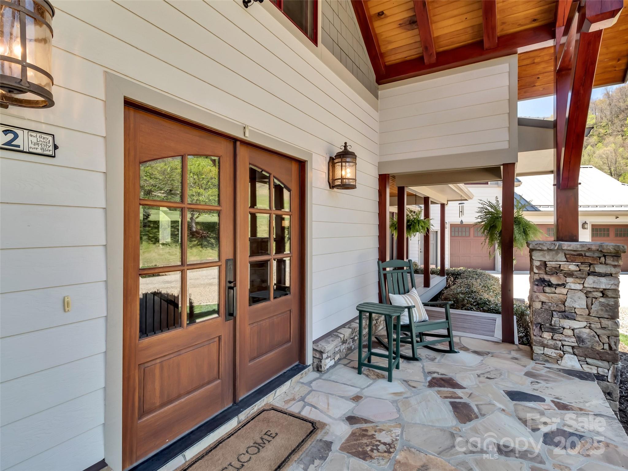 12 Rolling Meadow Lane Clyde, NC 28721 - Photo 5 of 44 a view of a patio with table and chairs near a barbeque