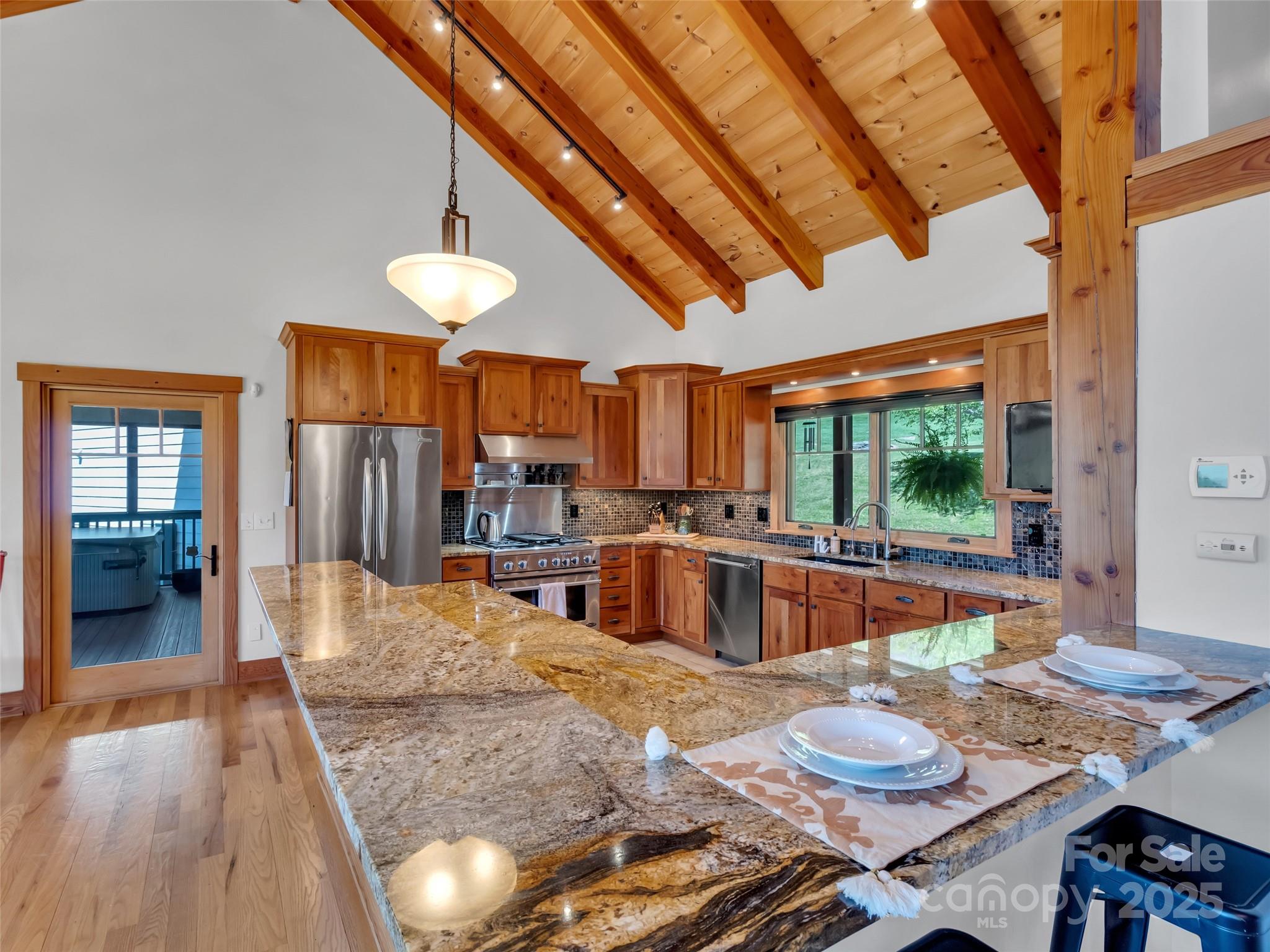 12 Rolling Meadow Lane Clyde, NC 28721 - Photo 9 of 44 a large kitchen with a table and chairs in it