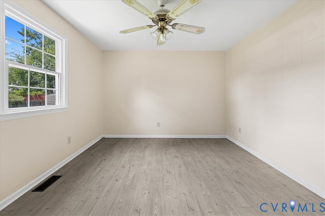 1618 Old Iron Road Hopewell, VA 23860 - Photo 11 of 25 Unfurnished room with light wood finished floors a