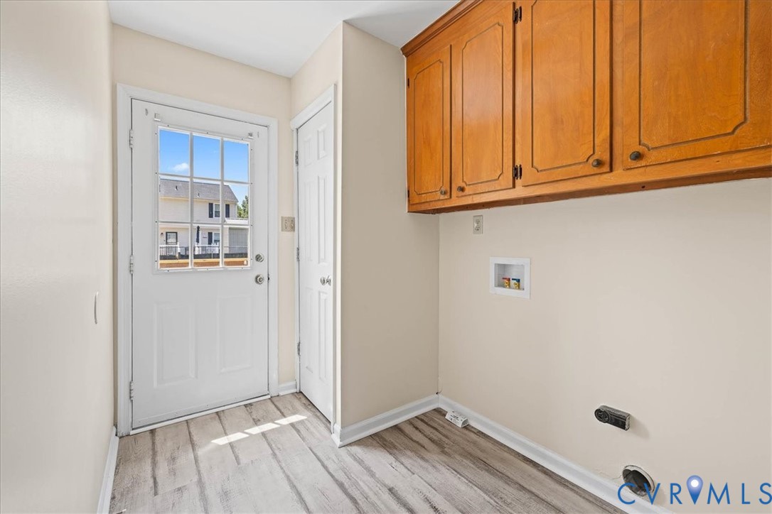1618 Old Iron Road Hopewell, VA 23860 - Photo 12 of 25 Laundry room featuring cabinet space, light wood-s