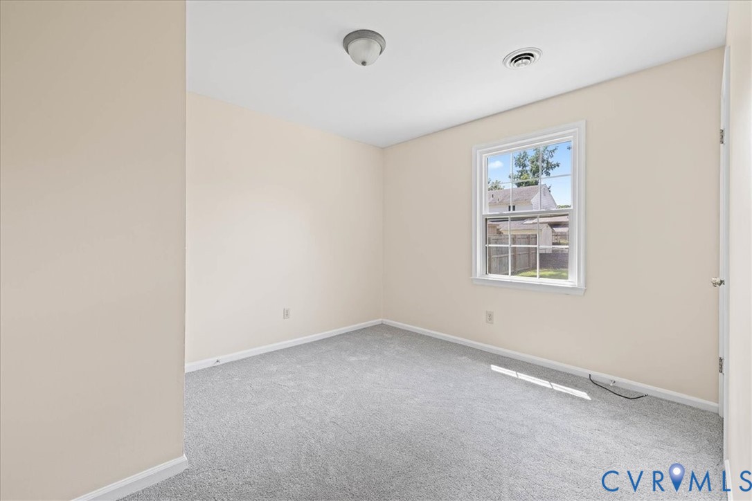 1618 Old Iron Road Hopewell, VA 23860 - Photo 14 of 25 Unfurnished room with carpet floors and baseboards