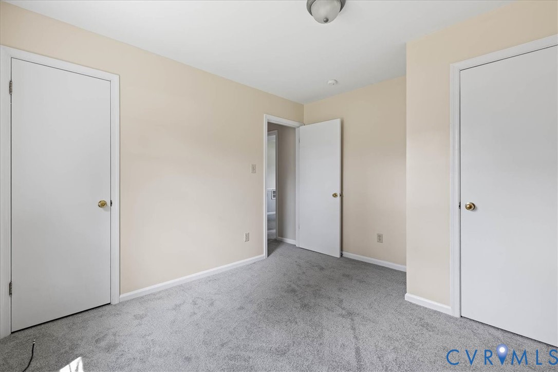 1618 Old Iron Road Hopewell, VA 23860 - Photo 15 of 25 Unfurnished bedroom featuring carpet floors and ba