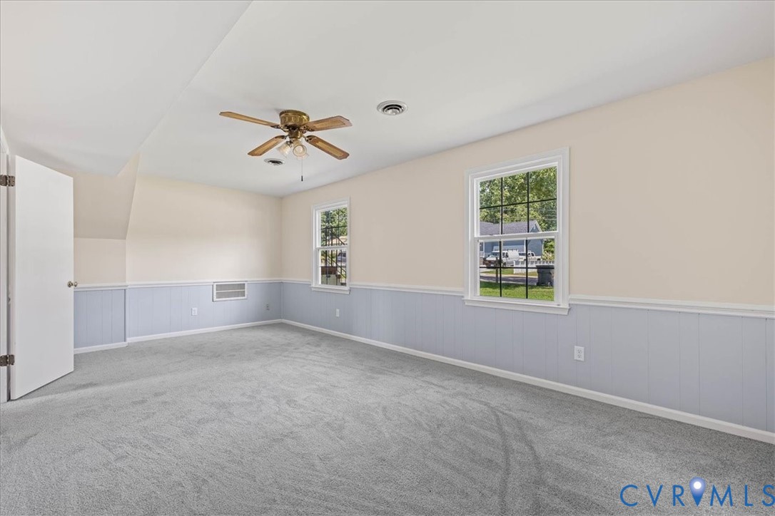 1618 Old Iron Road Hopewell, VA 23860 - Photo 17 of 25 Spare room with ceiling fan, a wainscoted wall, an