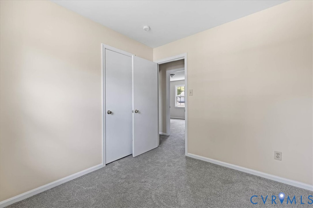 1618 Old Iron Road Hopewell, VA 23860 - Photo 19 of 25 Carpeted spare room with baseboards