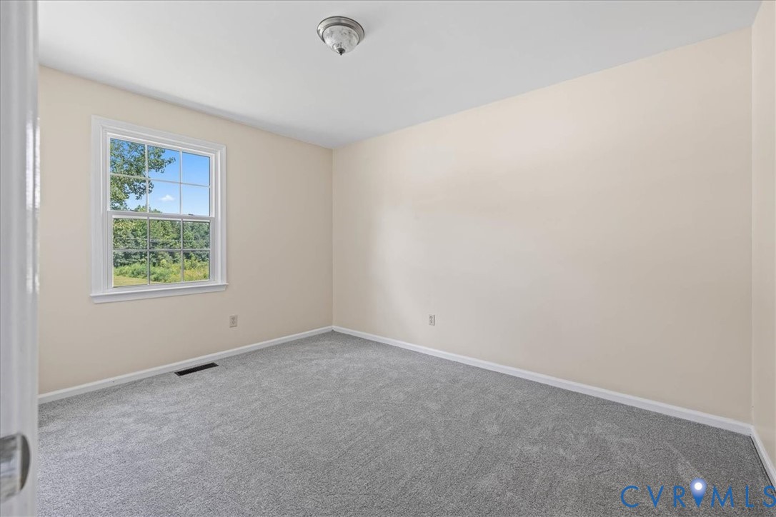 1618 Old Iron Road Hopewell, VA 23860 - Photo 20 of 25 Carpeted empty room featuring baseboards