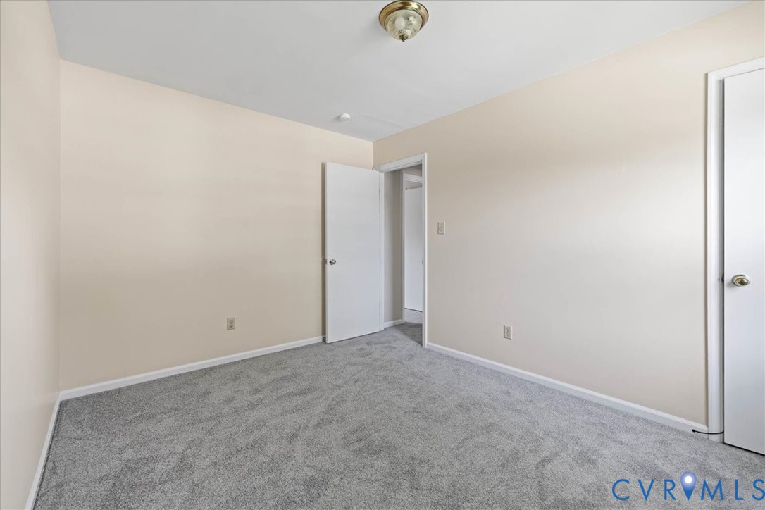 1618 Old Iron Road Hopewell, VA 23860 - Photo 21 of 25 Empty room featuring carpet floors and baseboards