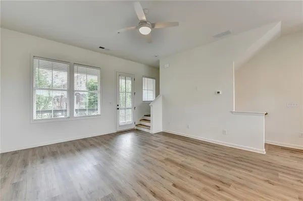 a view of kitchen and wooden floor