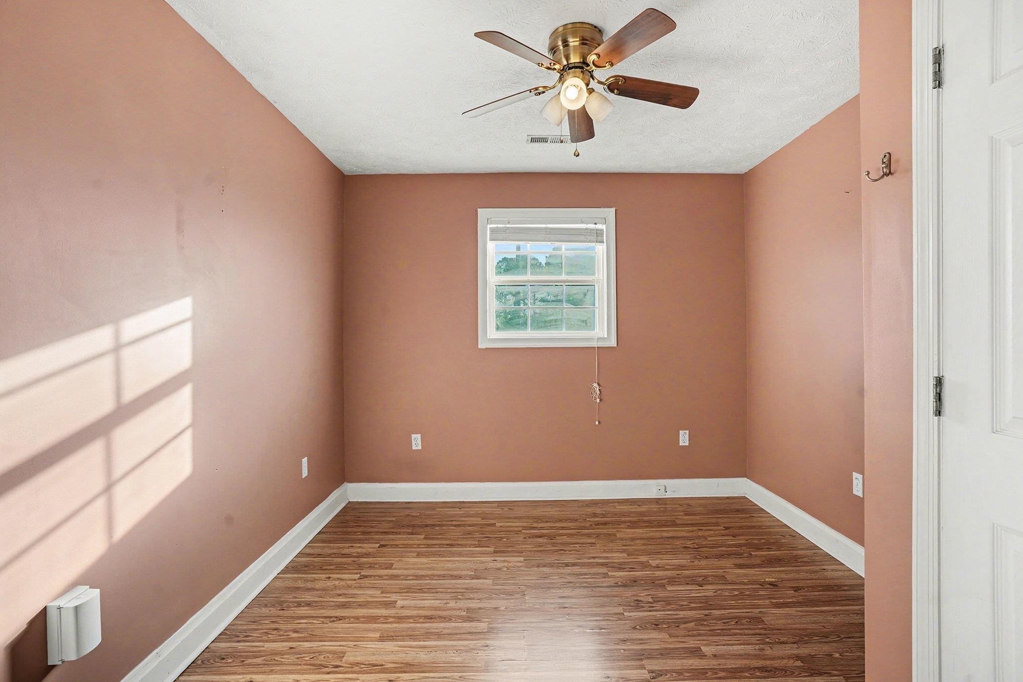 1897 Heritage Road Loris, SC 29569 - Photo 11 of 32 Kitchen with stainless steel appliances, butcher block countertops, light wood-style flooring, and a textured ceiling