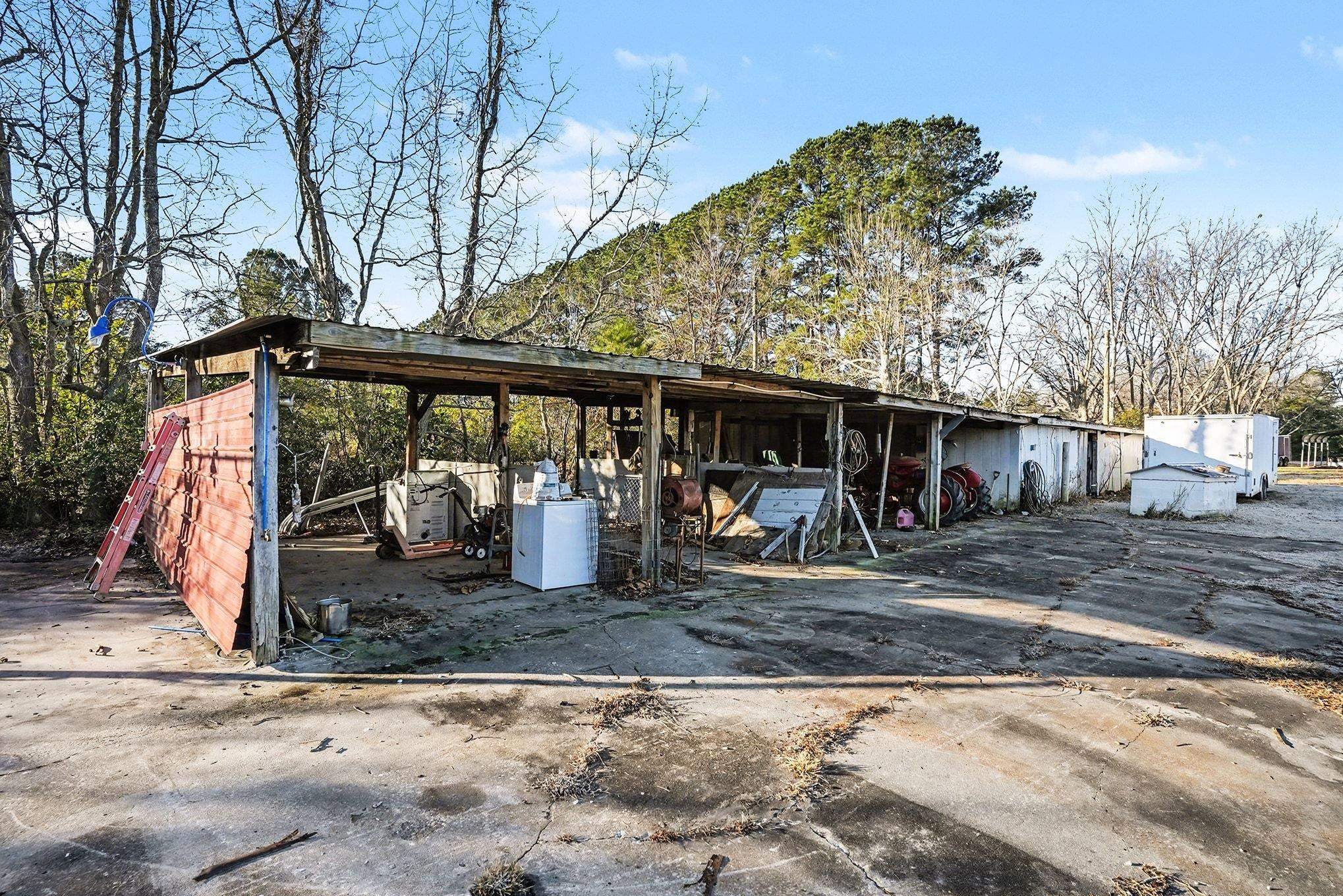1897 Heritage Road Loris, SC 29569 - Photo 23 of 32 View of grassy yard with a storage unit