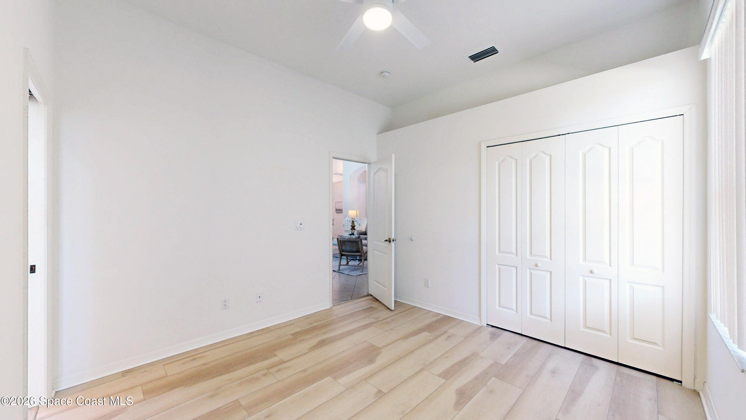 2703 Barrow Drive Merritt Island, FL 32952 - Photo 25 of 43 a view of empty room with wooden floor