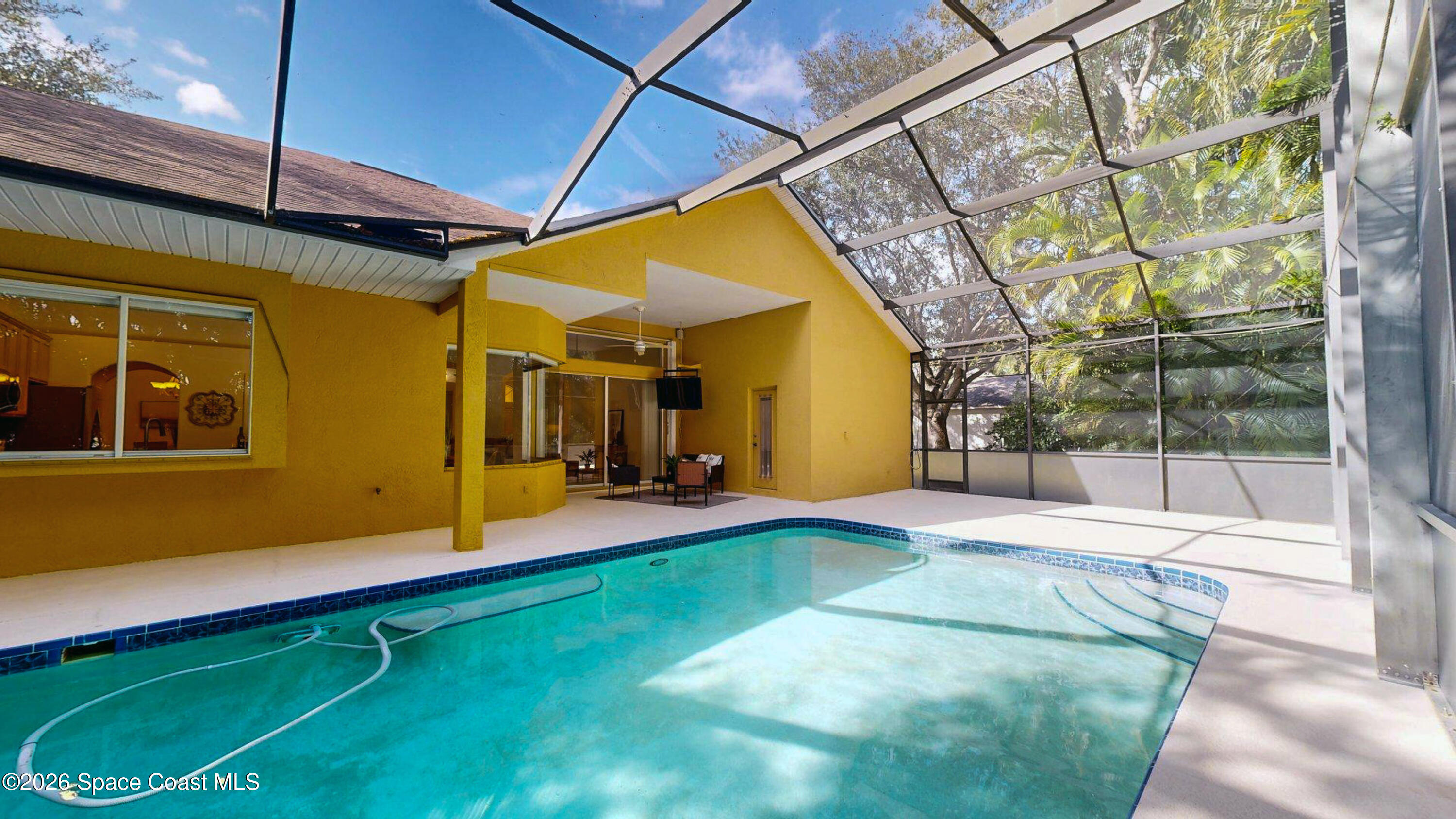 2703 Barrow Drive Merritt Island, FL 32952 - Photo 37 of 43 a house with swimming pool in front of it