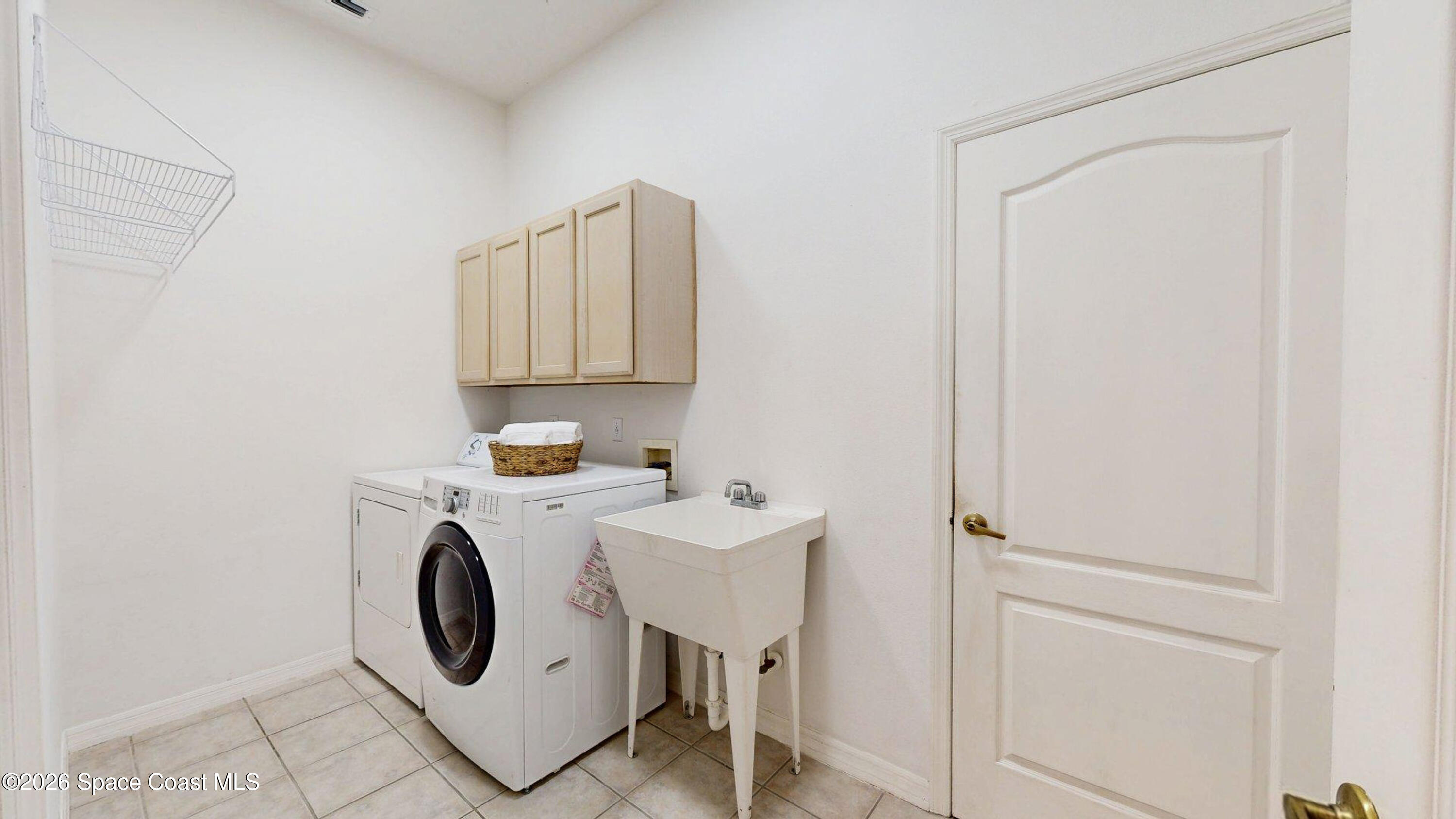 2703 Barrow Drive Merritt Island, FL 32952 - Photo 40 of 43 a utility room with dryer and washer