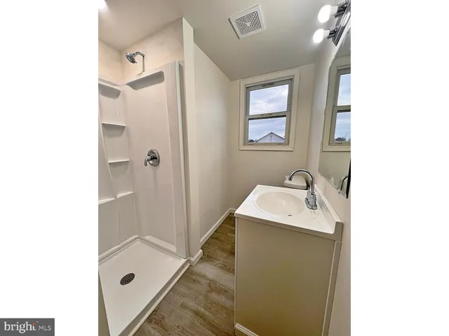 a bathroom with a sink and mirror