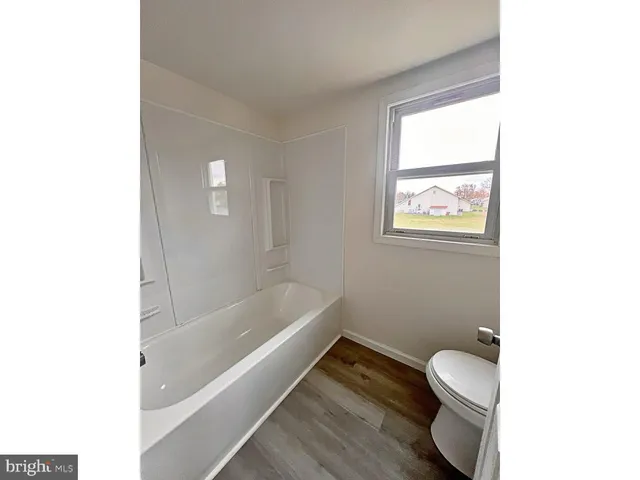 a bathroom with a sink toilet and bathtub