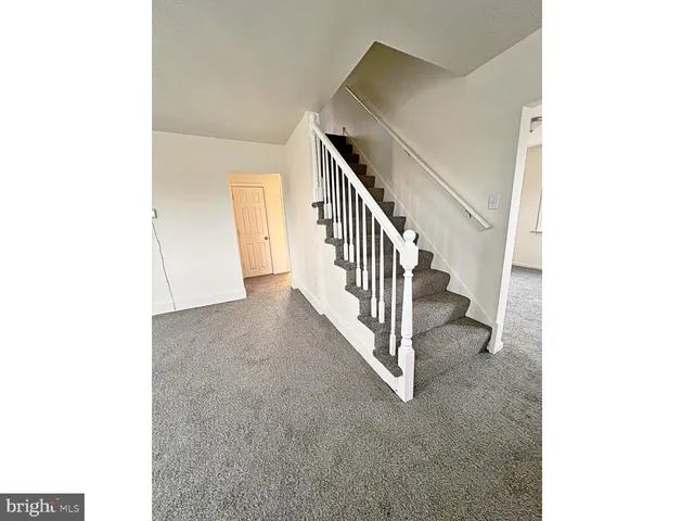 a view of a hallway with staircase