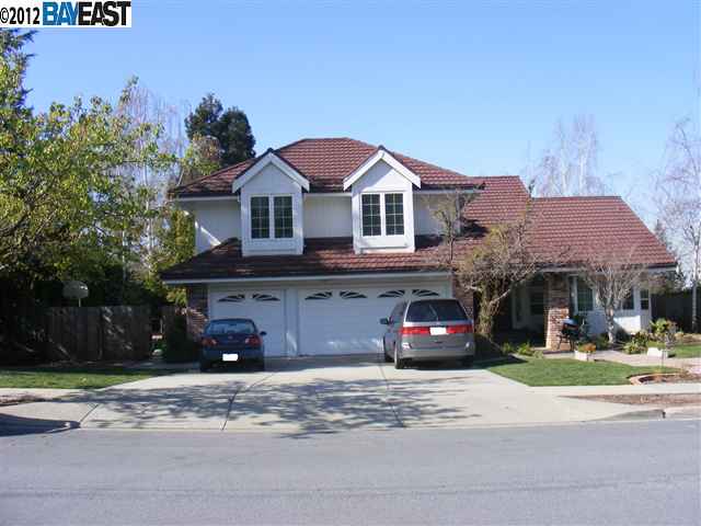 47207 Rancho Higuera Road Fremont, CA 94539 - Photo 1 of 1 a front view of a house with a garden