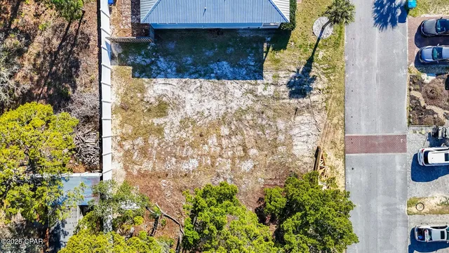 an aerial view of a house with a yard and garden