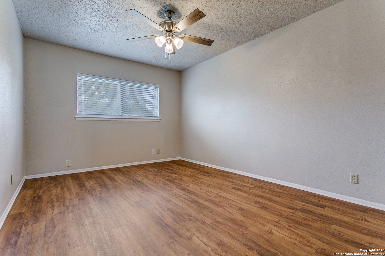 2803 Fred Haise Drive Kirby, TX 78219 - Photo 14 of 24 a view of an empty room with a window
