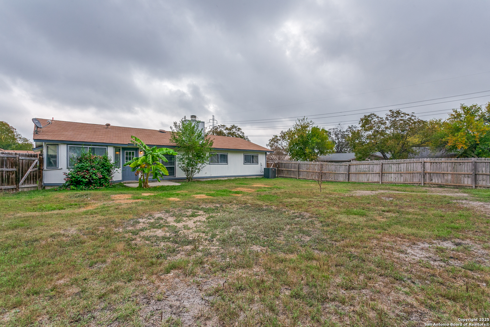 2803 Fred Haise Drive Kirby, TX 78219 - Photo 23 of 24 a house view with swimming pool in front of it