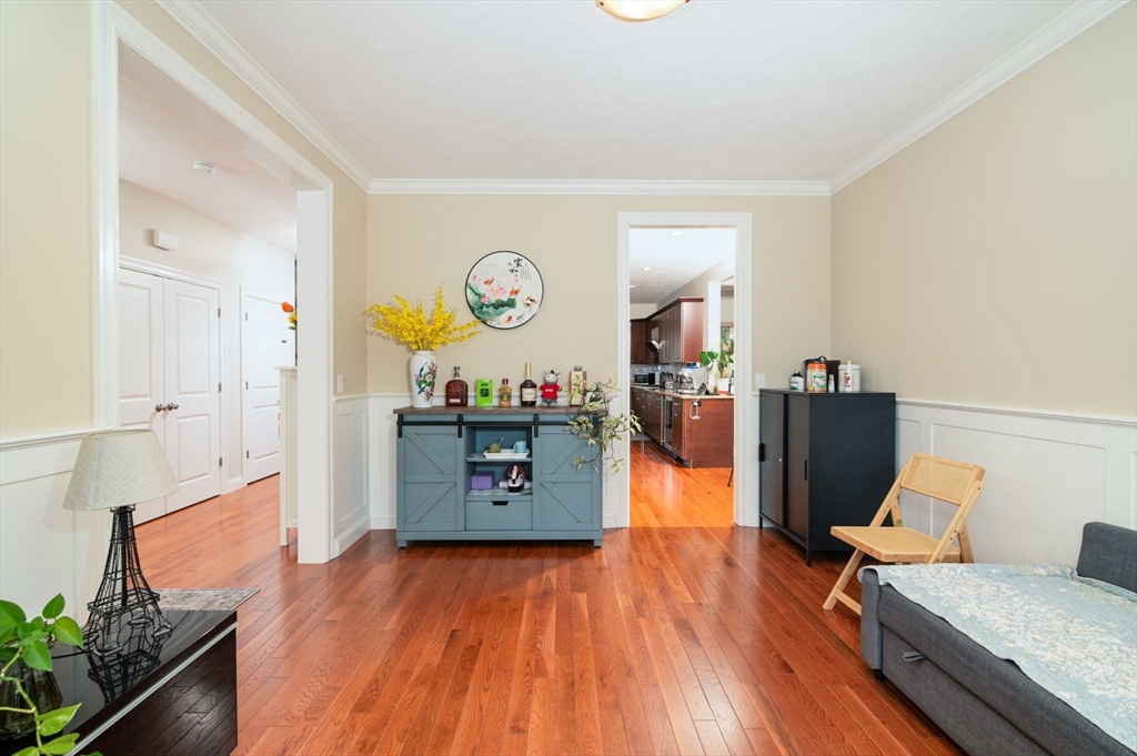 51 Tamarack Road Dracut, MA 01826 - Photo 6 of 39 a living room with a table and a chairs