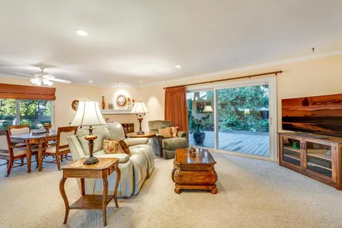 a bedroom with a bed and a television