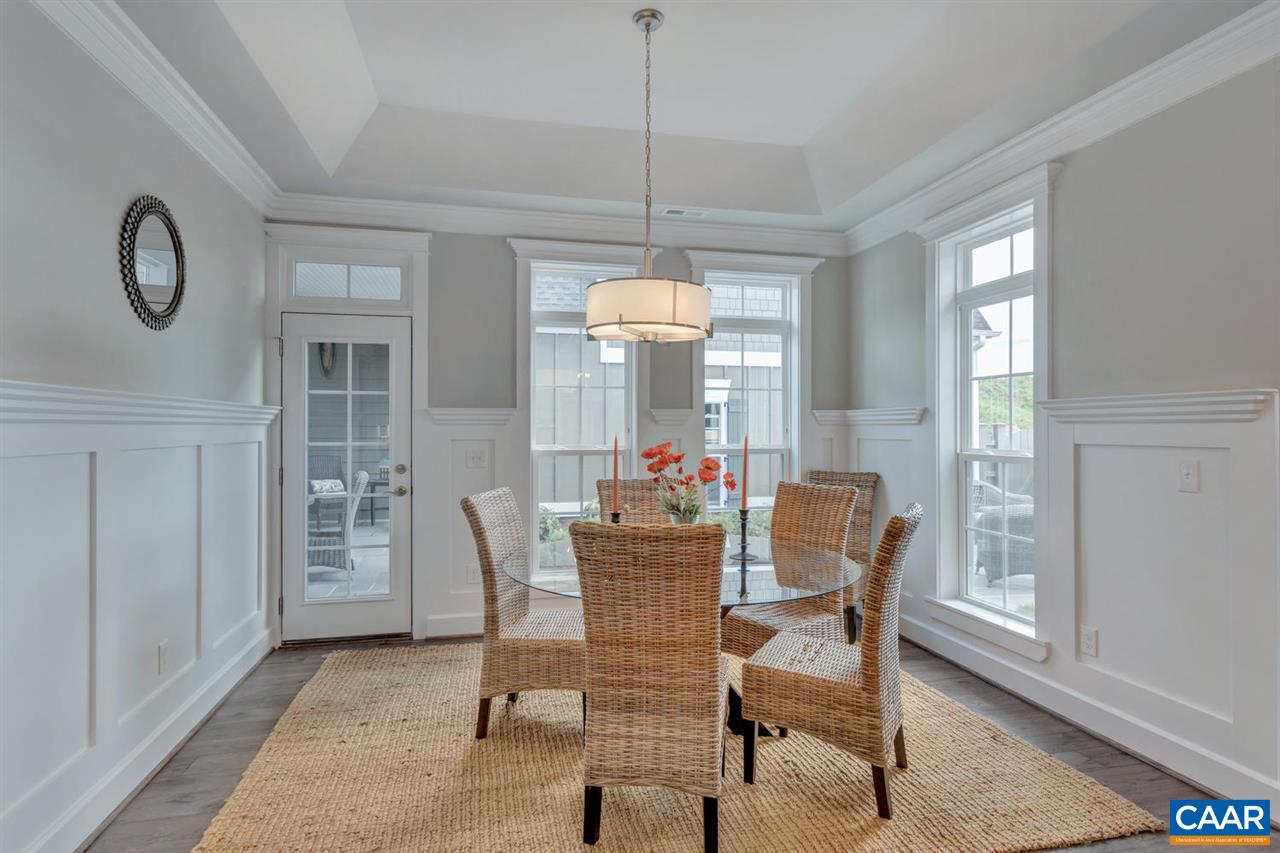 30 Portelet Road Crozet, VA 22932 - Photo 12 of 25 a dining room with furniture a chandelier and wooden floor