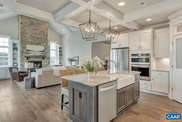 a kitchen with stainless steel appliances granite countertop a stove oven and a refrigerator