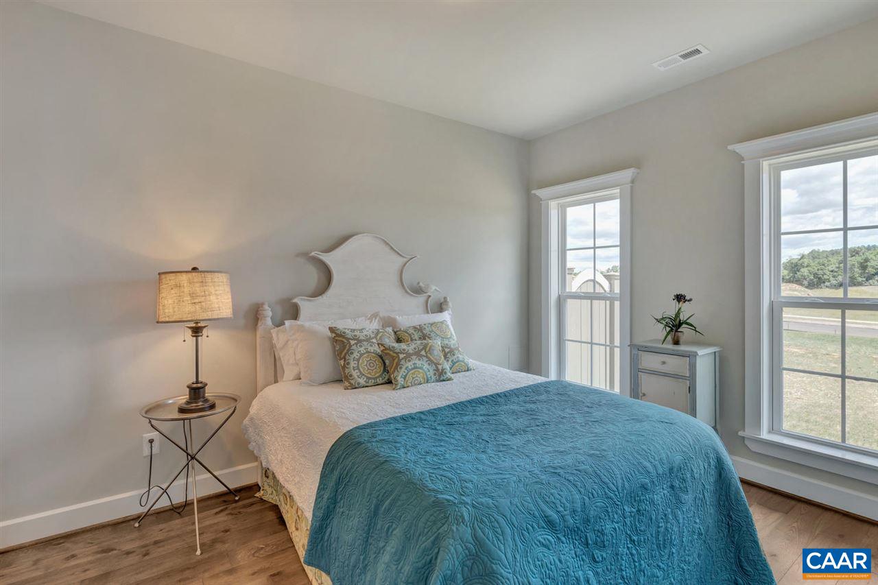 30 Portelet Road Crozet, VA 22932 - Photo 4 of 25 a bedroom with a bed and a large window