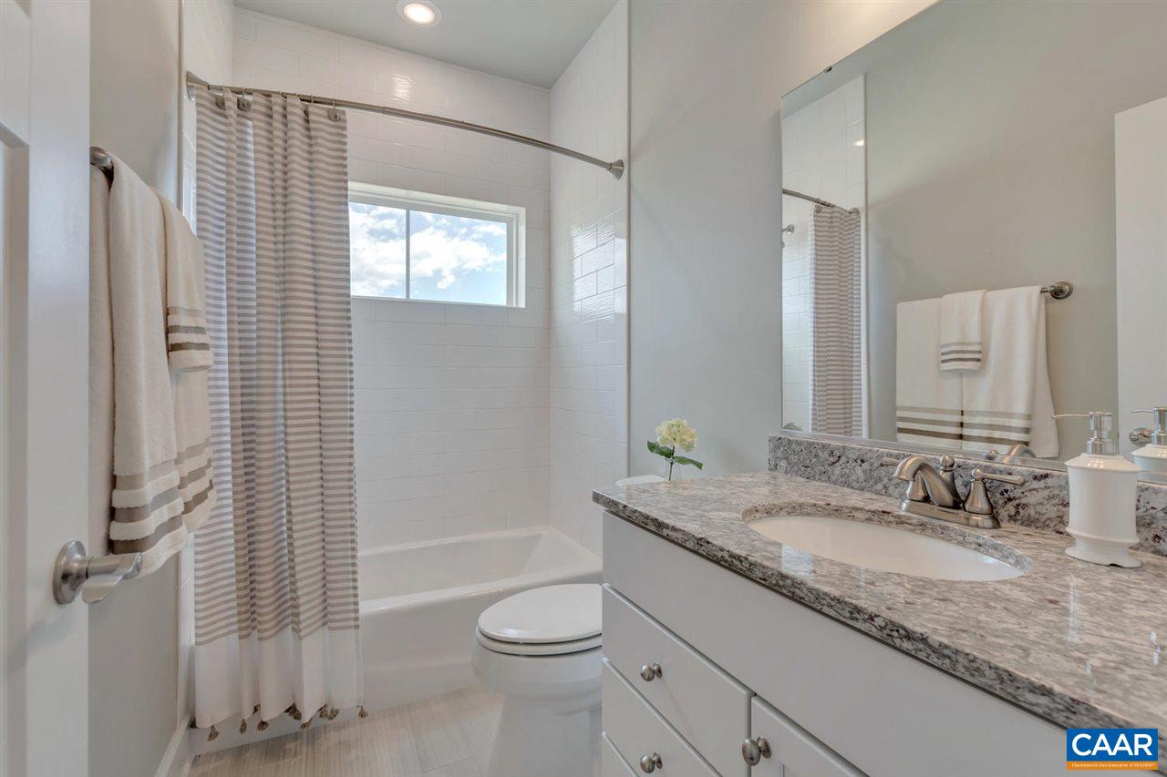 30 Portelet Road Crozet, VA 22932 - Photo 5 of 25 a bathroom with a granite countertop sink toilet and shower
